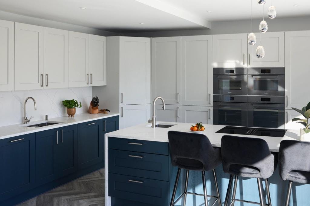 Blue & white Shaker kitchen with waterfall island