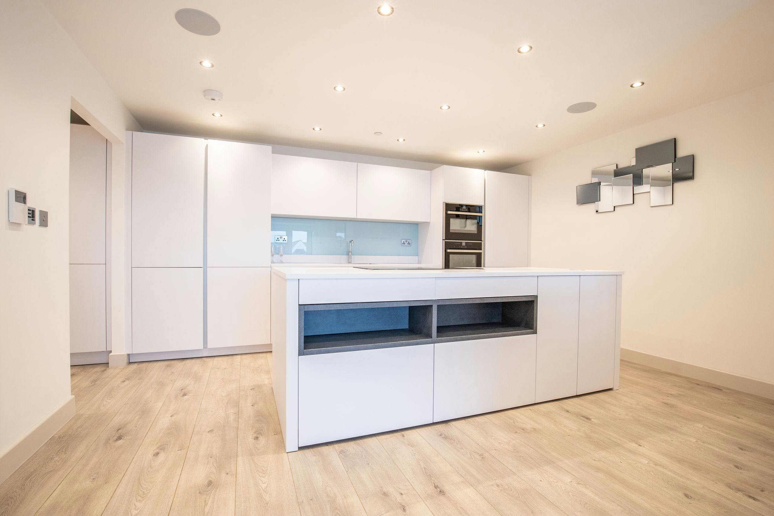 White handleless apartment kitchen